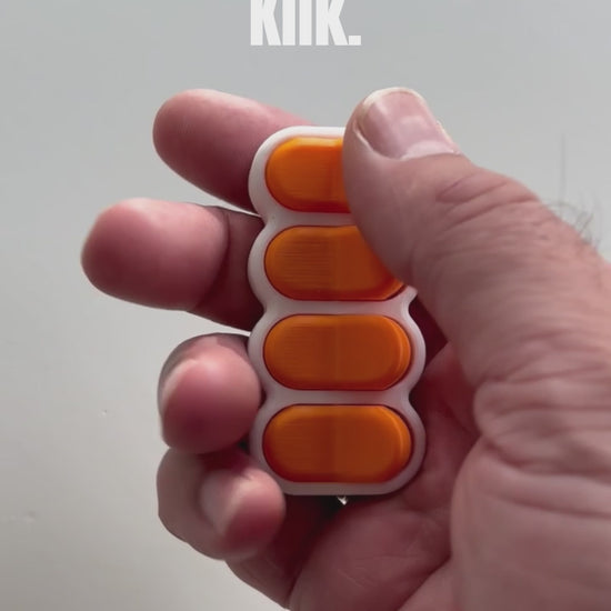 Bradey Clickkey fidget clicker 4 knoppen wit oranje